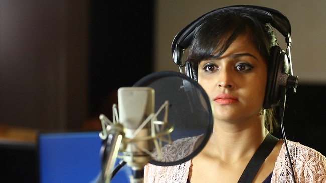 Actress Remya Nambeesan Singing Song in Koothan Stills